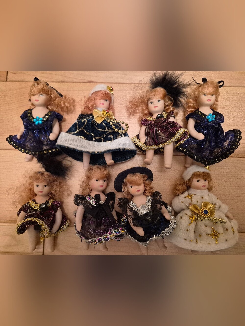 8 small vintage (I believe) porcelain dolls
